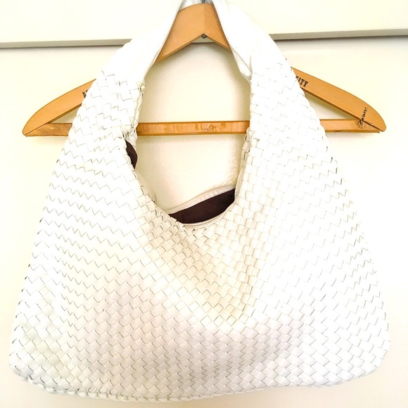 from Anthropologie Handbags - Anthropologie White Woven Vegan Leather Hobo Bag. Please see description